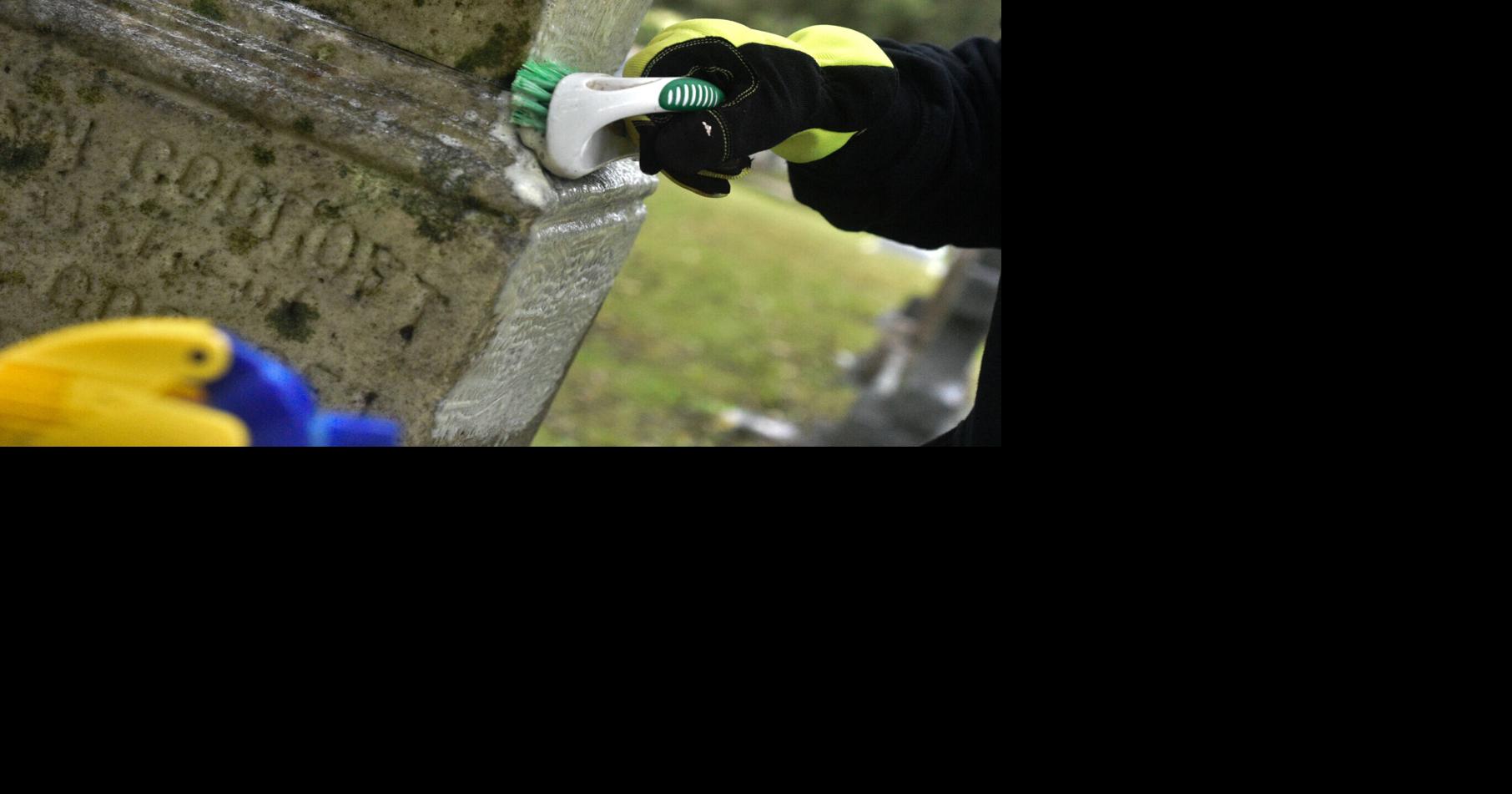 Volunteers teach us how to clean cemetery headstones