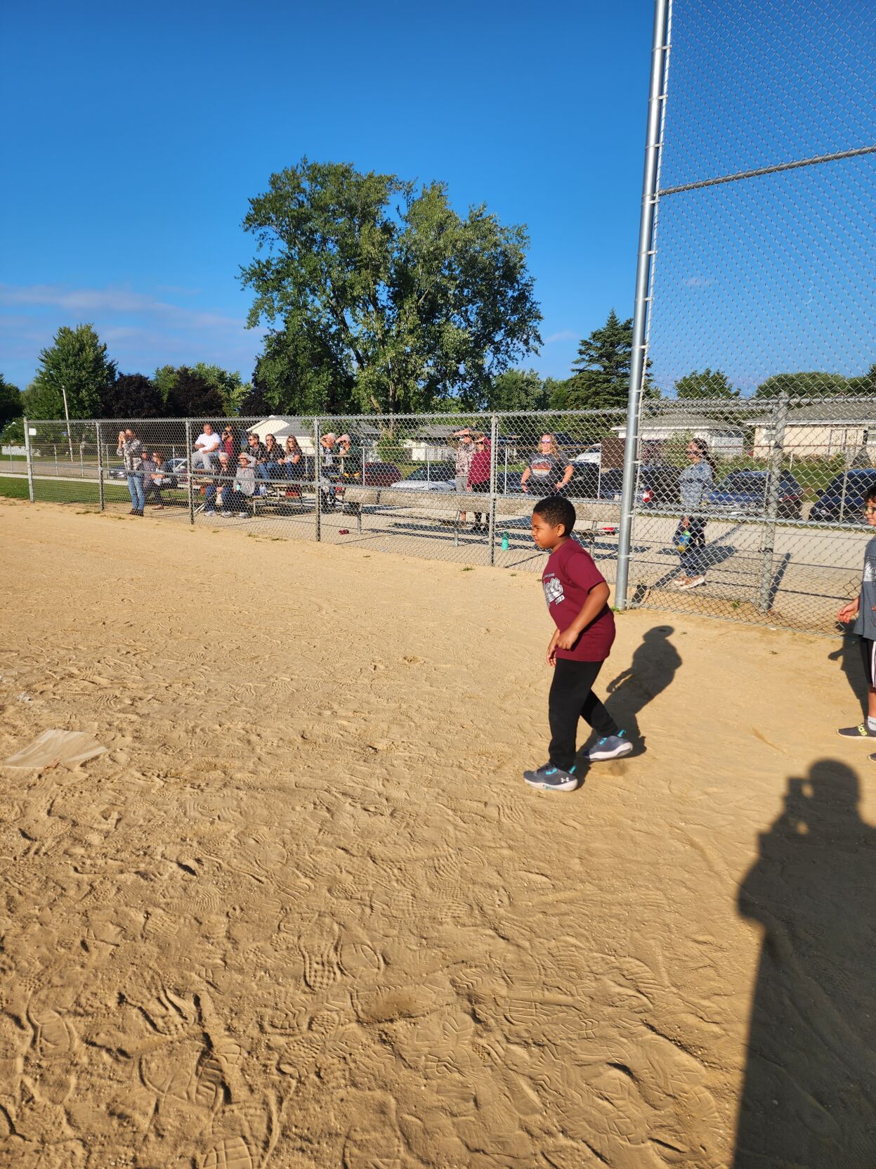 Kai playing kickball
