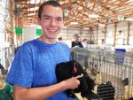 Aiden Brink of Waterford with his champion bantam chicken at Racine County Fair