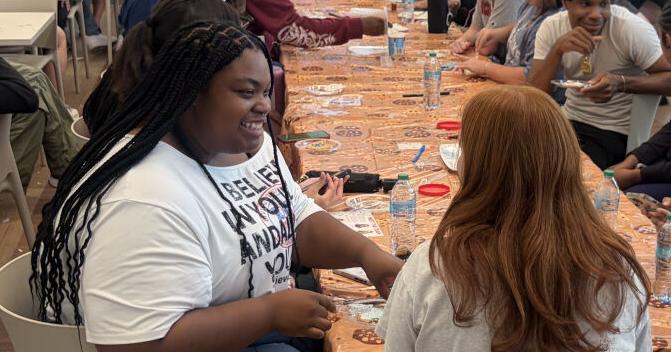 Students pack the dining room for One Smart Cookie