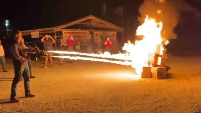 A flamethrower and comments about book burning ignite a political