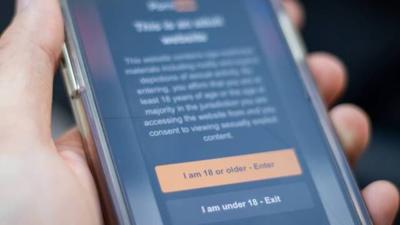 Pornhub blocks access to Kansas over new law requiring users to ...