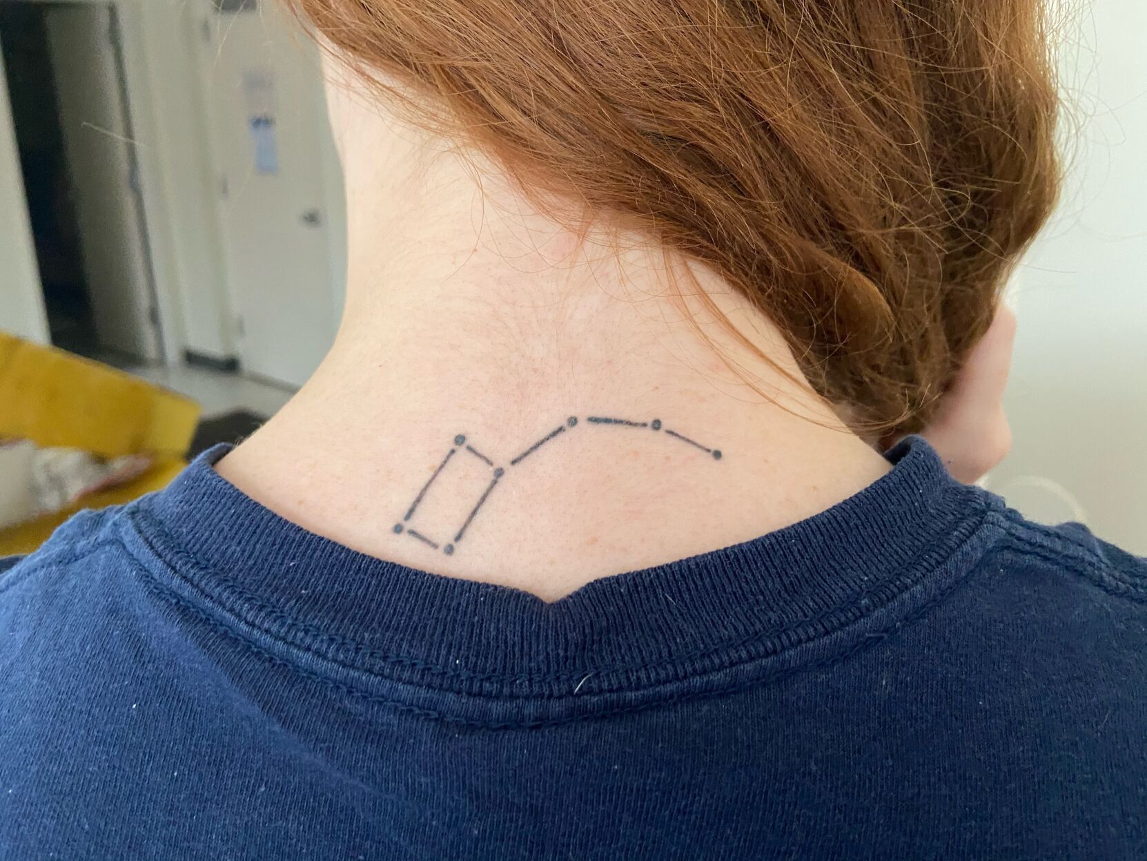 Big Dipper constellation tattoo on the upper back