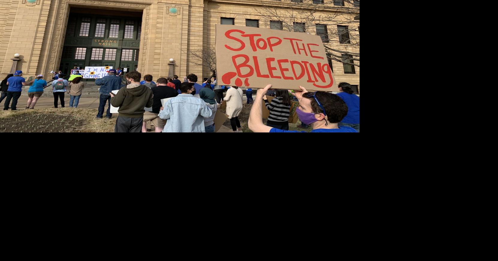 Dozens of KU students and staff march to Strong Hall to protest budget ...