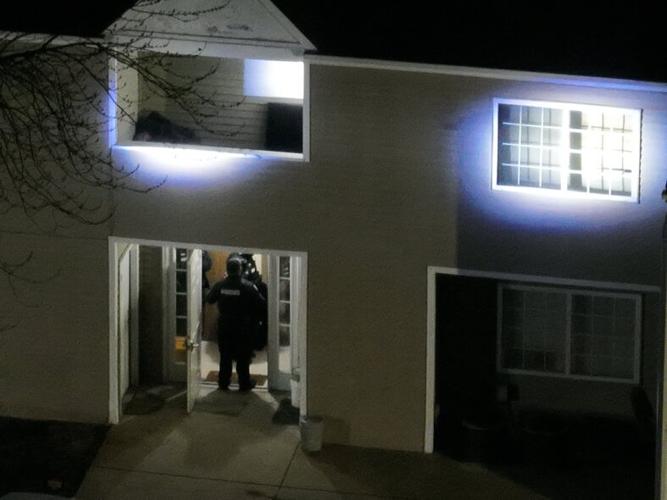 Police prepare to enter the apartment