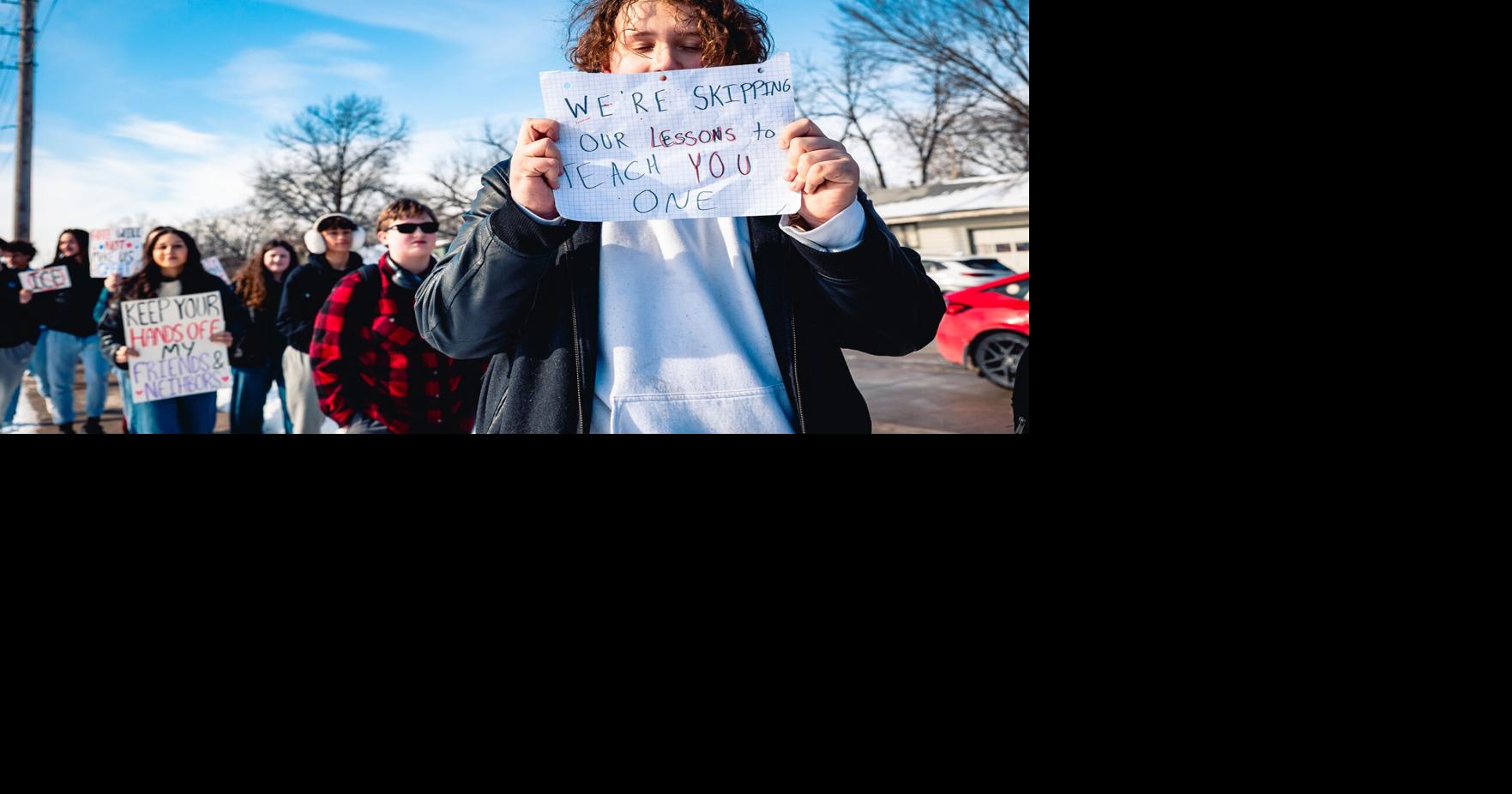 KU community joins Lawrence High School students in protest against ICE