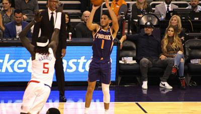 Booker scores 16 as Suns cool off streaking Raptors, 99-95