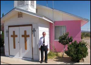 Pastor leads congregation at Dolan Springs little pink church