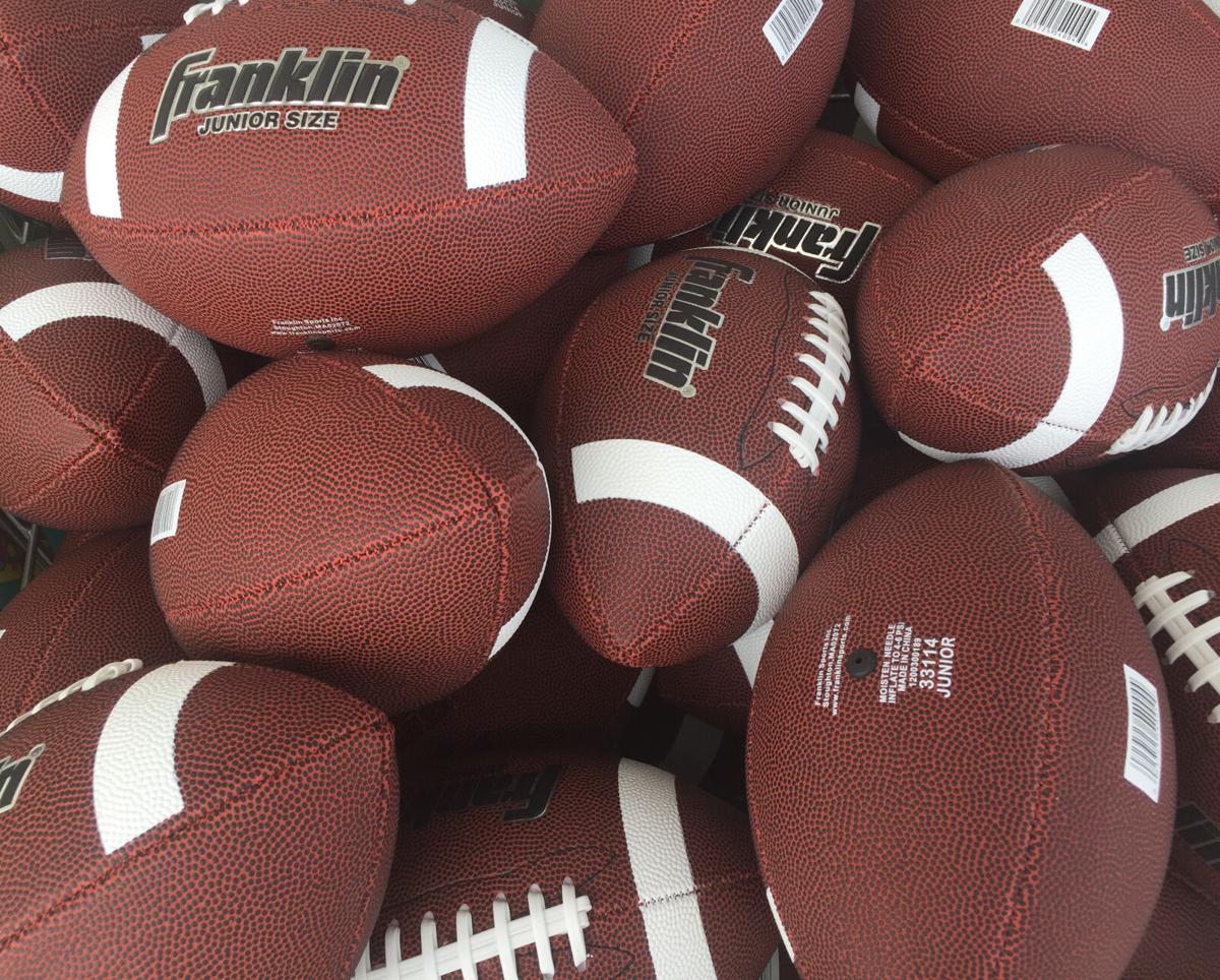 bin of footballs