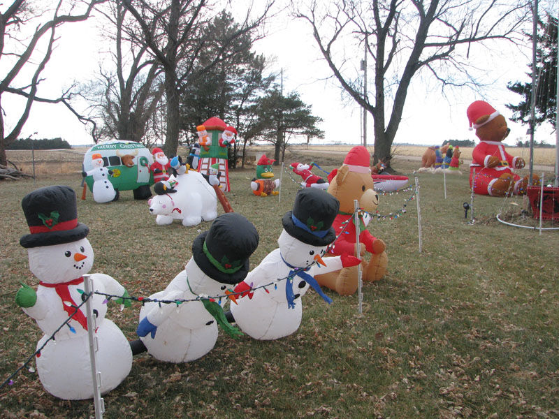 Gibbon man sets up 100 holiday inflatables for half-acre Christmas display