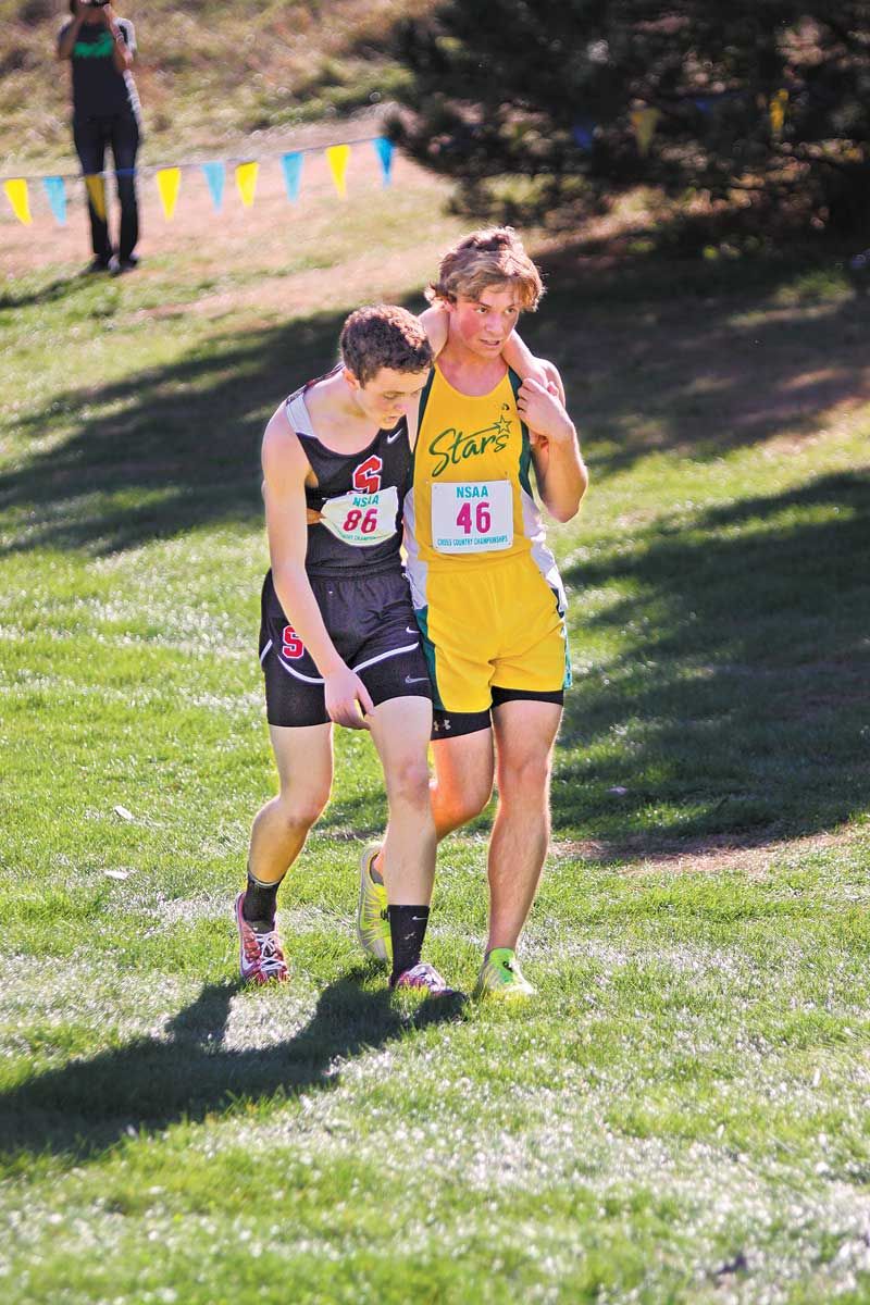 Kearney Catholic runner helps competitor finish cross country race