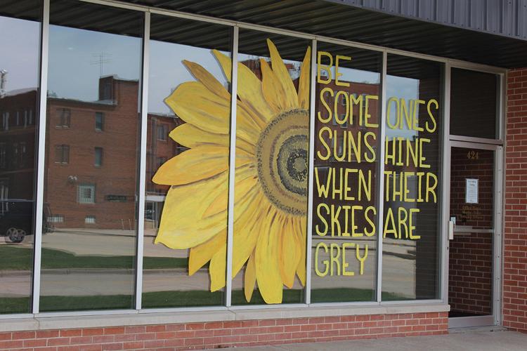 Artist inspiring Holdrege with murals for businesses