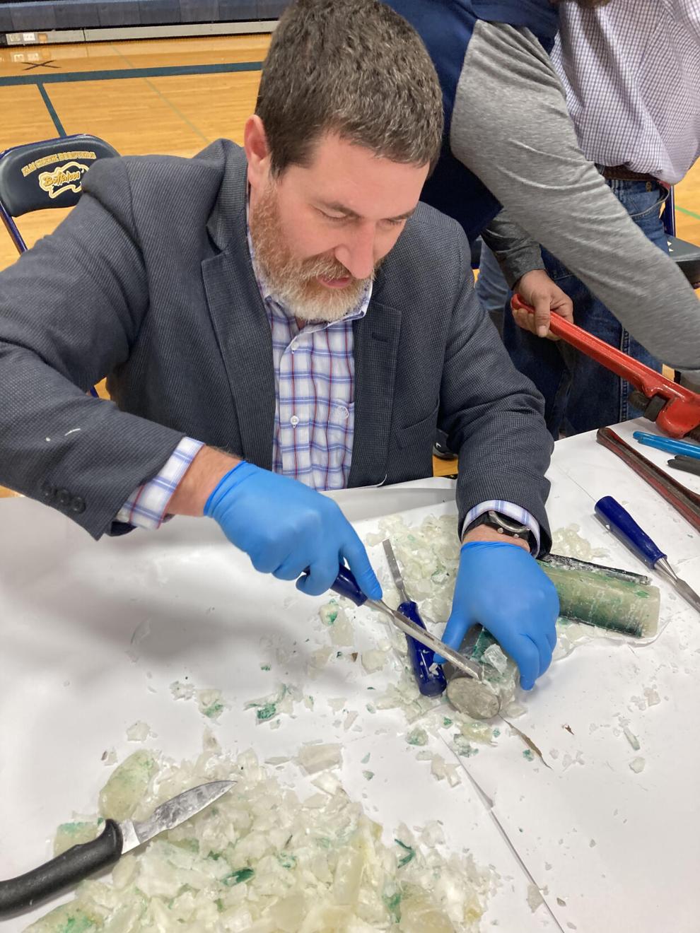 A penny. Old newspapers. Treasures found in Elm Creek