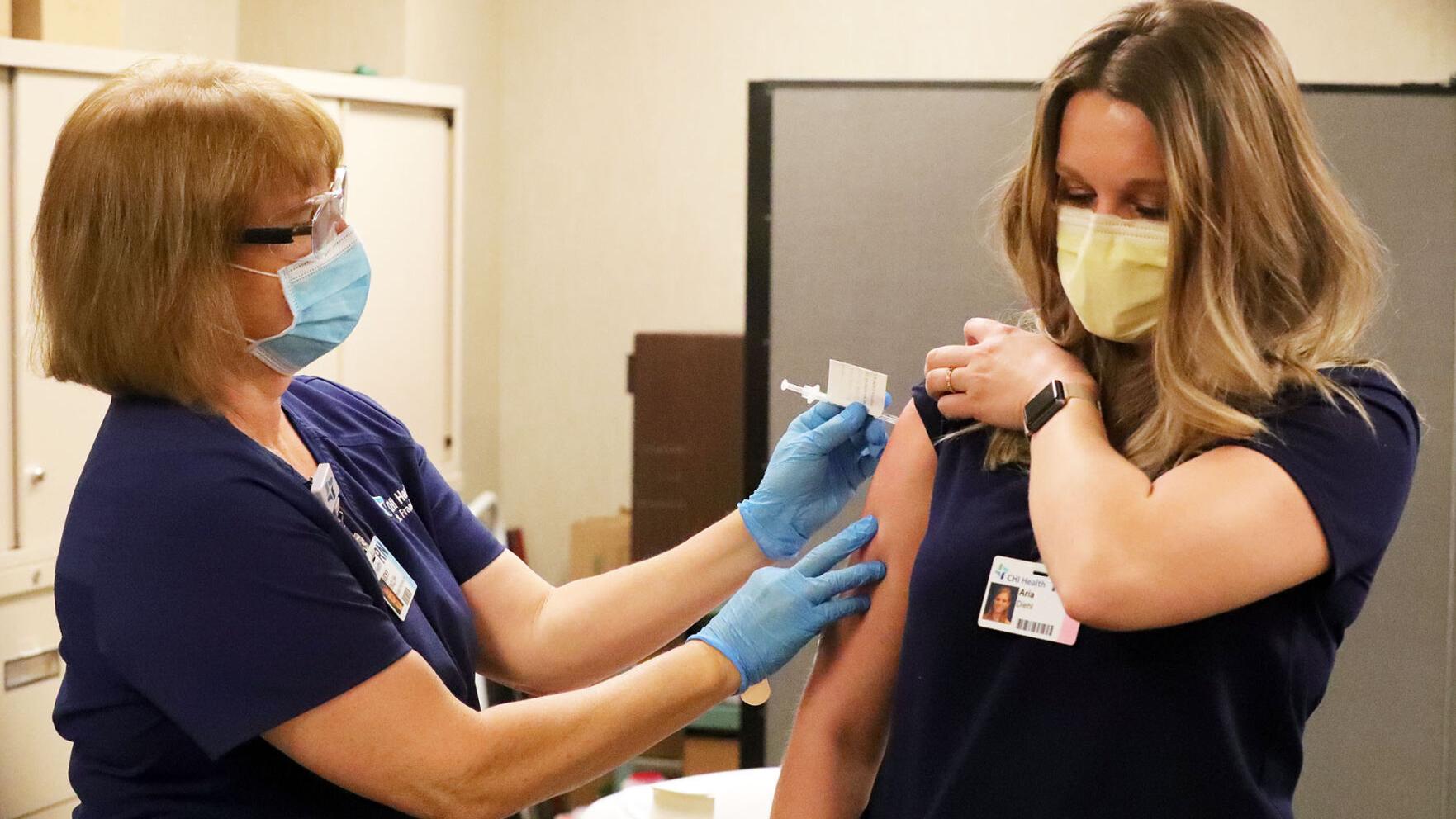 'A step in the right direction': First CHI staff to receive vaccine report minor reactions, increased optimism - Vimarsana News
