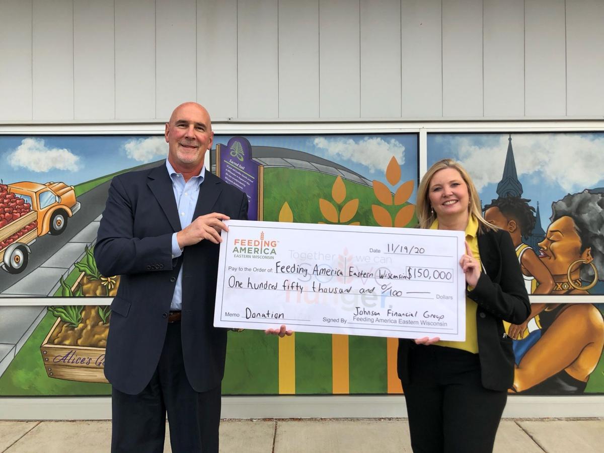 Johnson Financial Group CEO Jim Popp presents $150,000 donation to Feed America