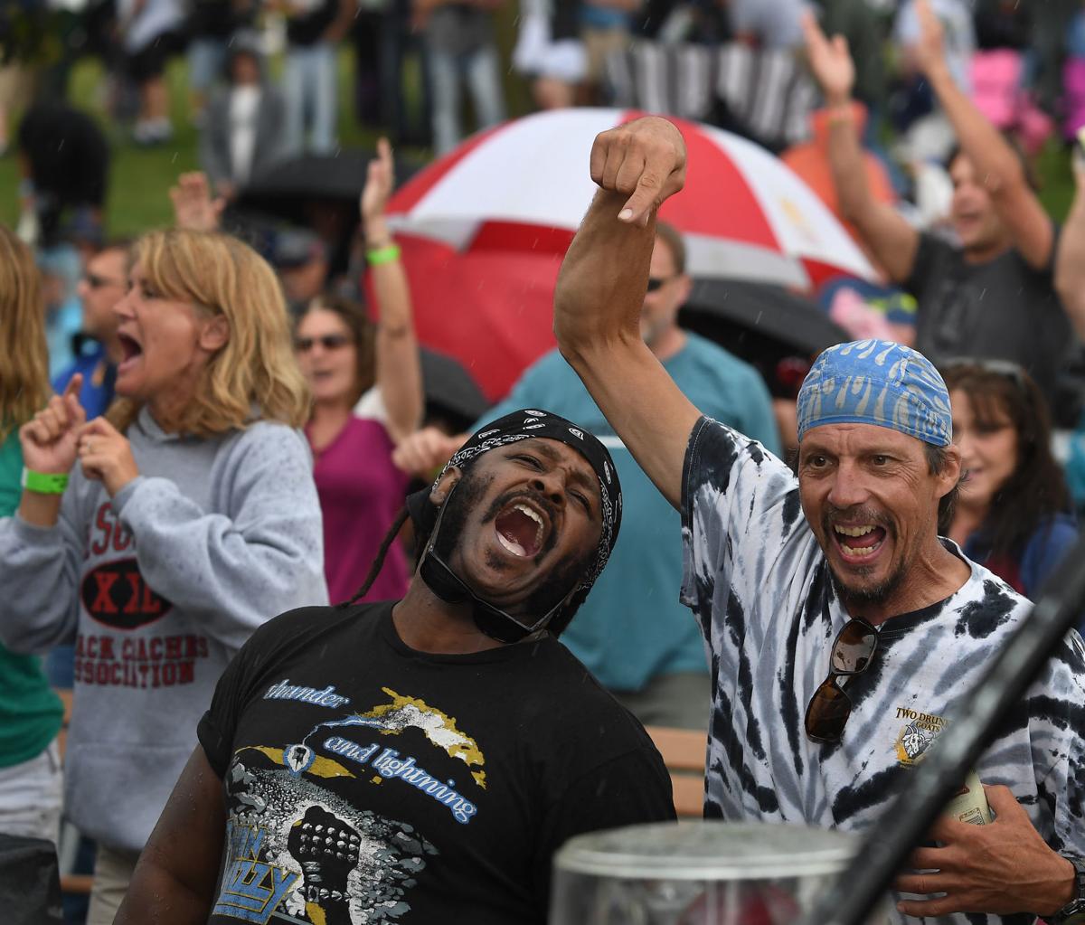 Rain dampens crowds, but not enthusiasm, at Tribute Island Local News