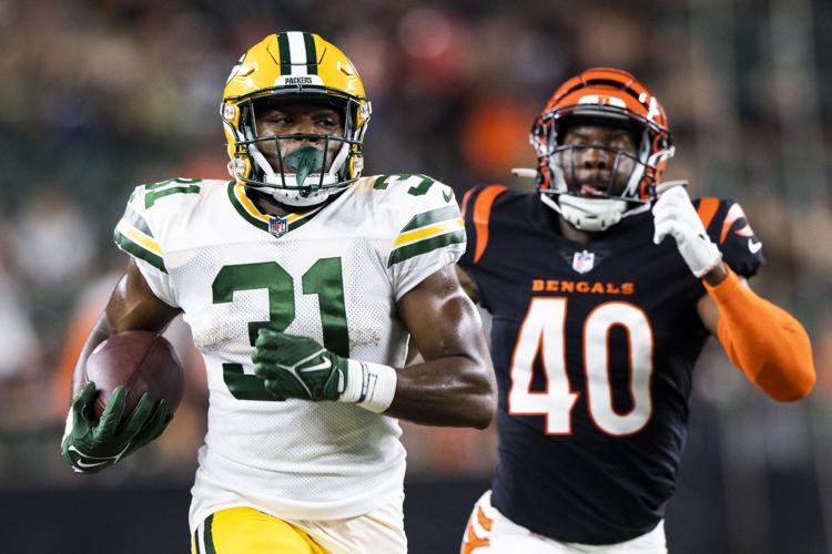 AJ Dillon uses 'dad strength' to take over run game, propel Packers