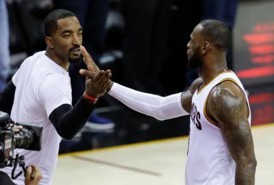 Cavs' J.R. Smith holds premature baby girl for first time in