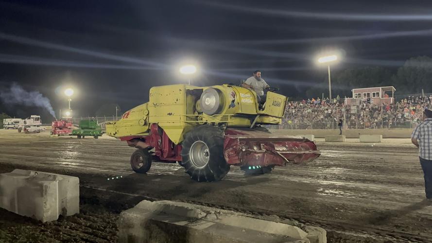 Fairgoers flock to the truck and tractor pulls and stay for combine