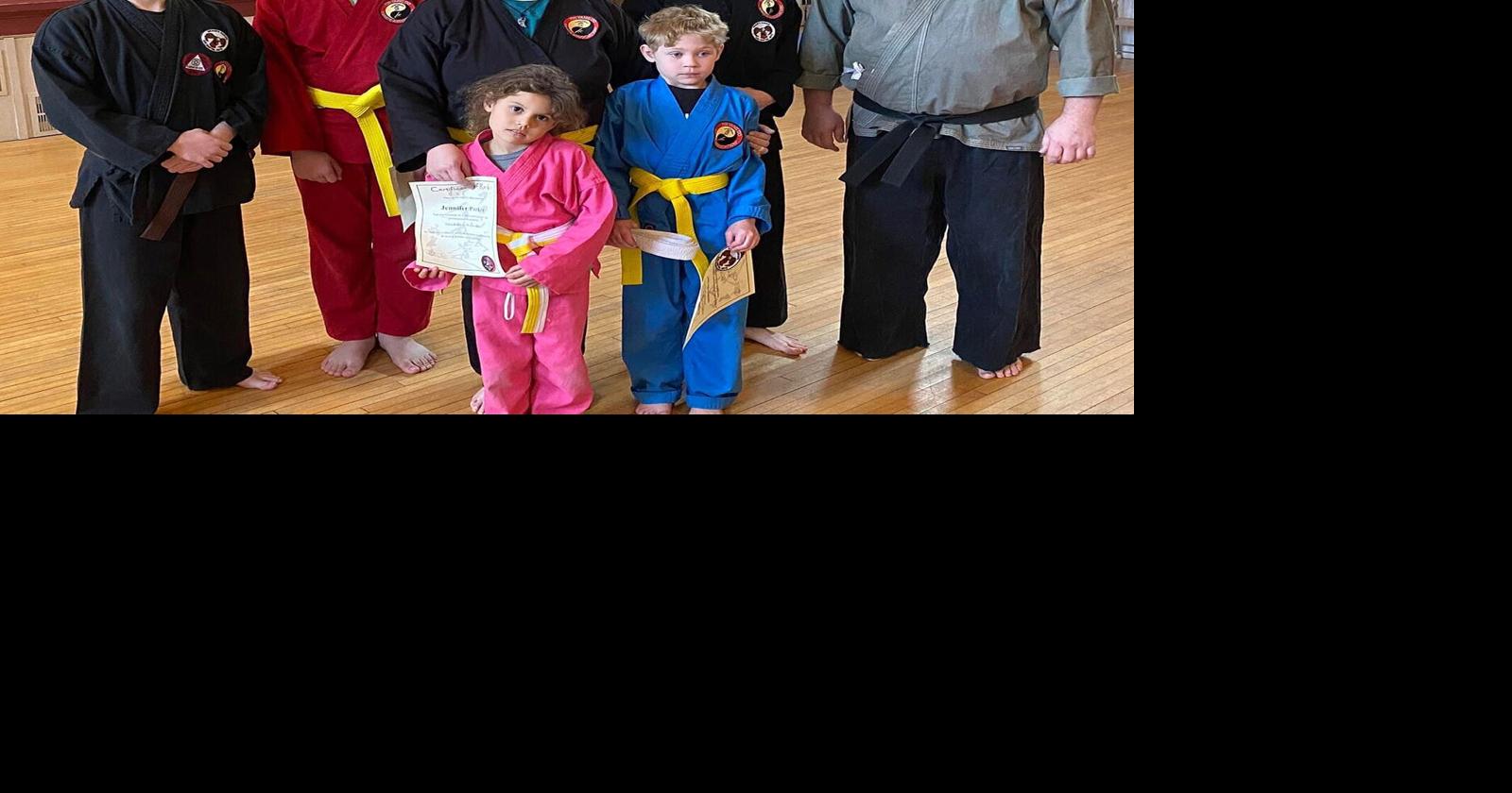 Area family all earn yellow belts in karate at Kenosha dojo