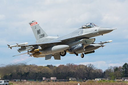 F-16 Fighting Falcons fly overhead during the New York Jets