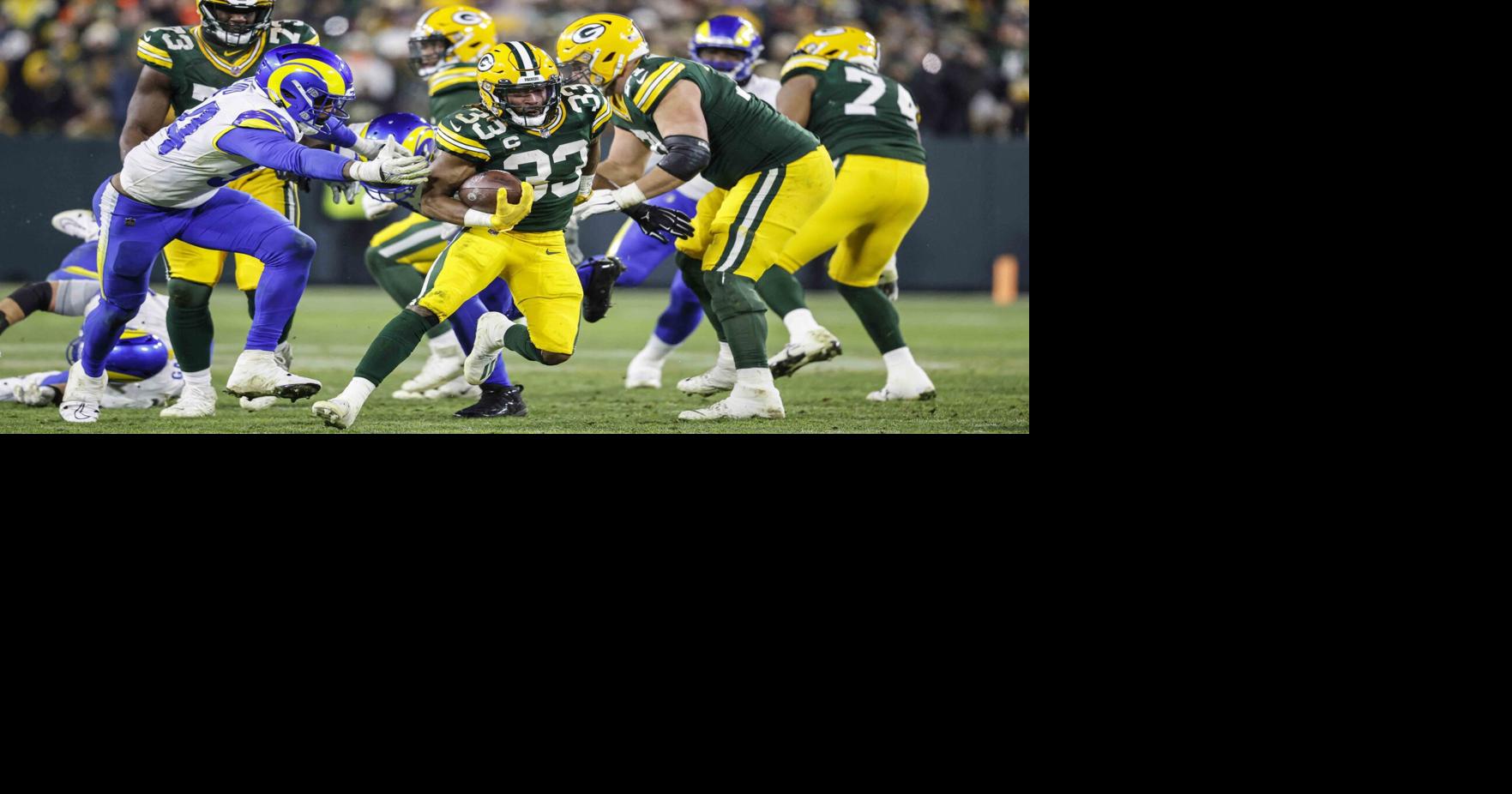 AJ Dillon helps Packers beat Rams to keep playoff hopes alive