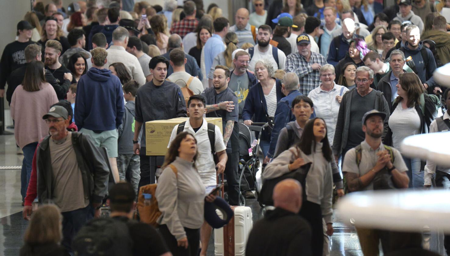 Travelers cope with crowds and high prices