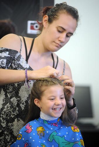 Stylists help pamper foster kids with free haircuts in time for school