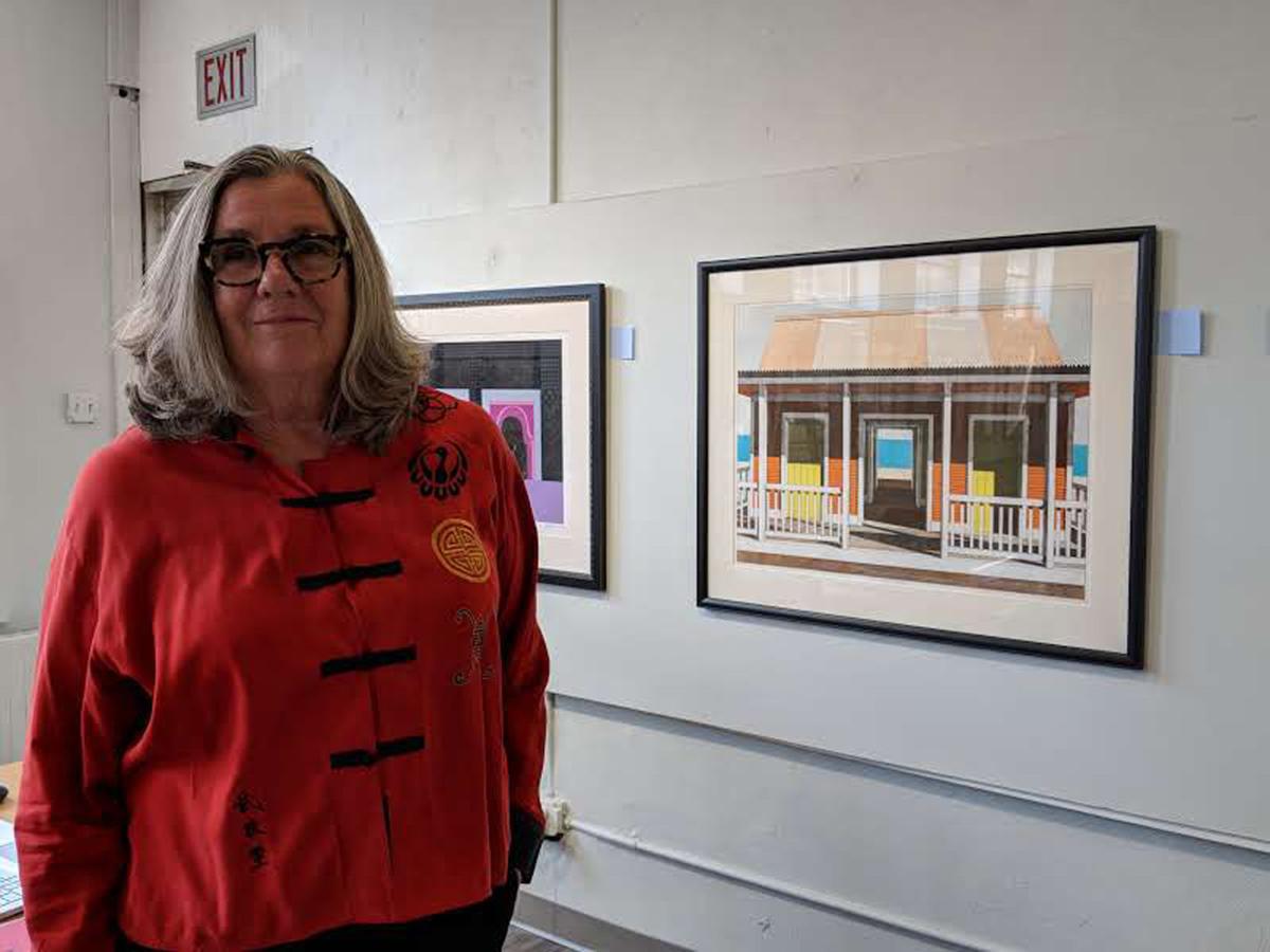 Margaret Heller with Mexican paintings.jpg