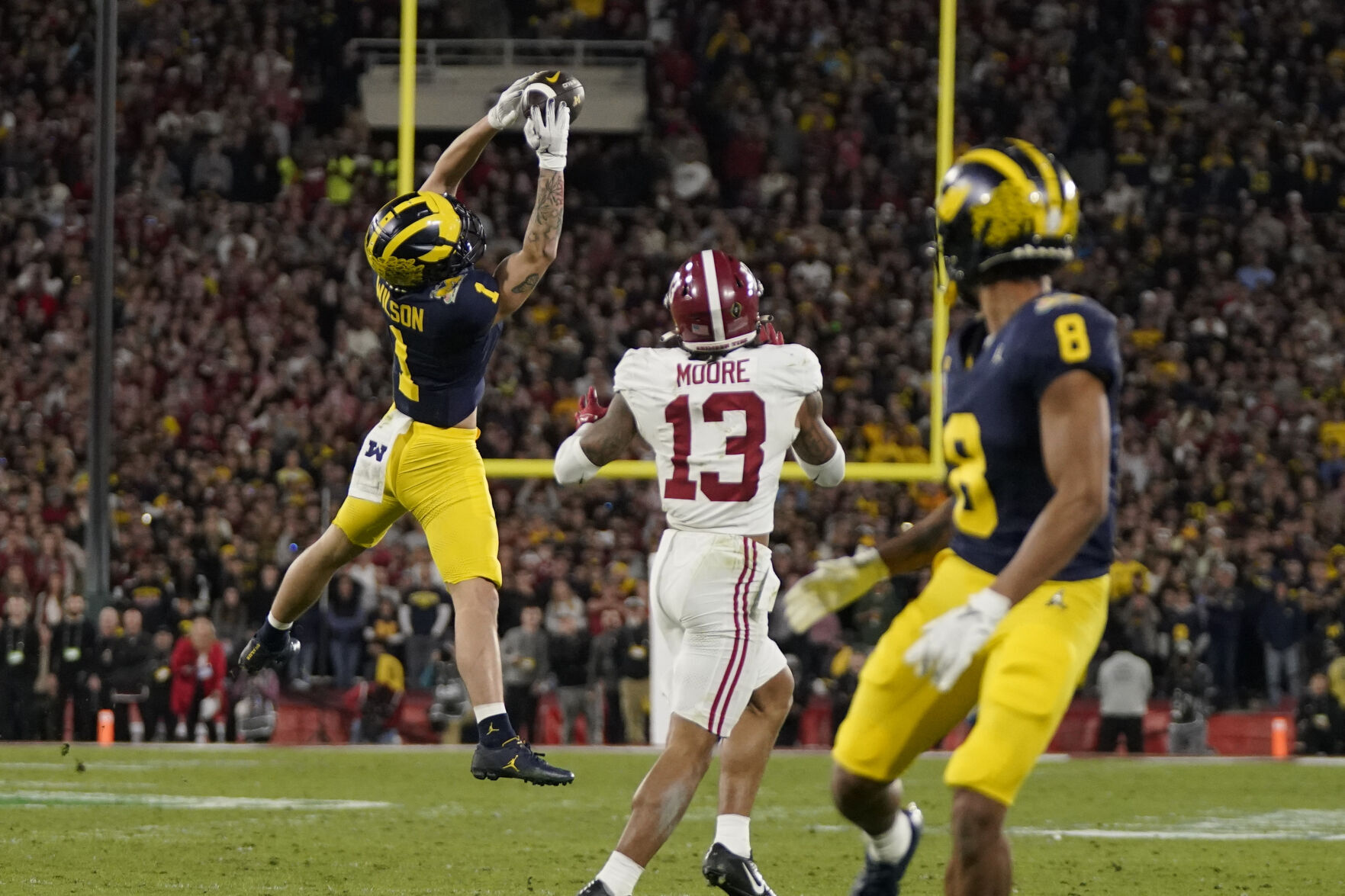 Michigan beats Alabama in OT to reach CFP title game