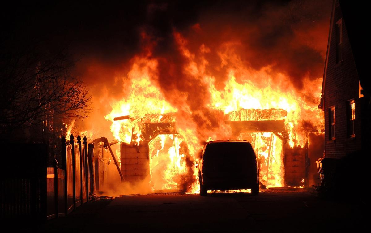 Fire destroys one garage, damages another on city's south side; no one