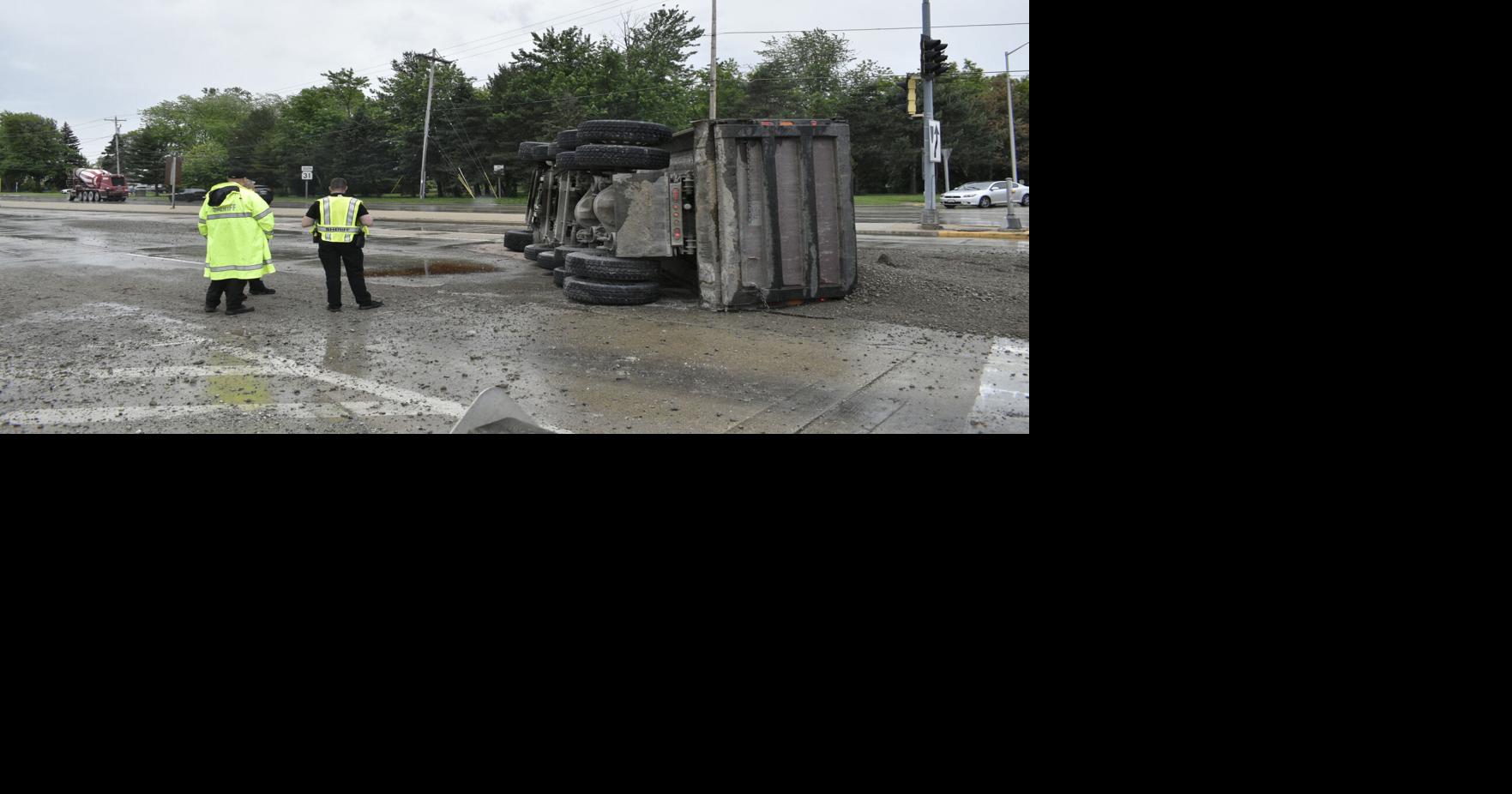 Security footage of dump truck tipping over on Green Bay Road