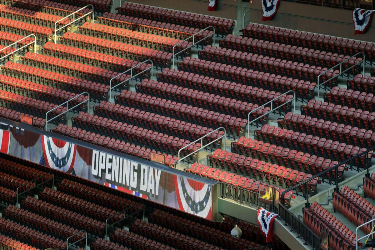 Empty stands, masked players as baseball returns