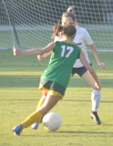 A Lady Blazers player dribbles with the ball