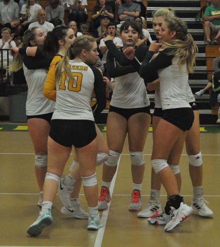 University Heights players celebrate a point against Christian County