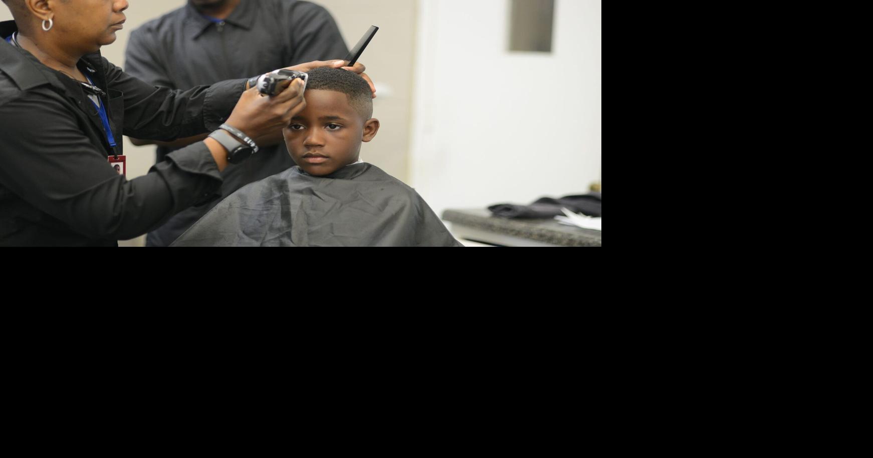 Barbers offer free or discounted hair cuts before school starts