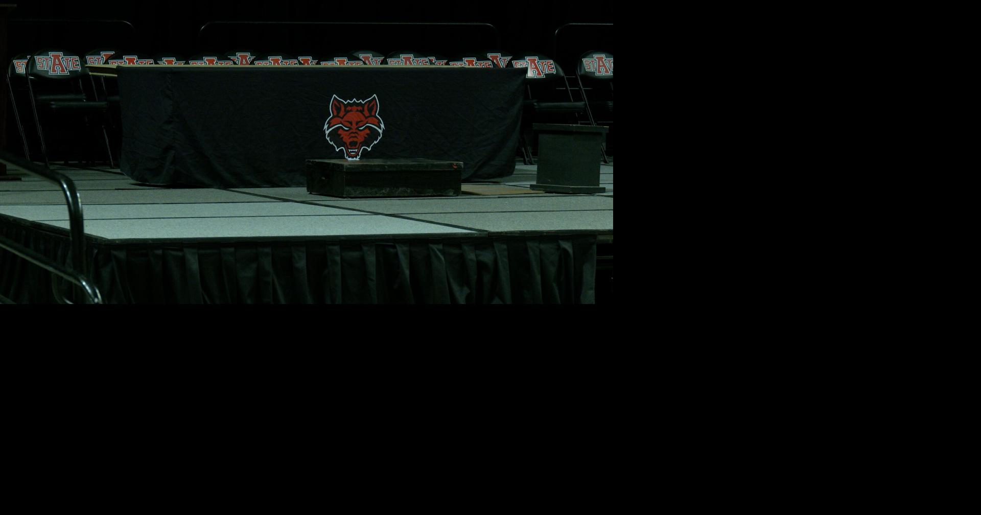 Arkansas State graduates prepare to walk across the stage