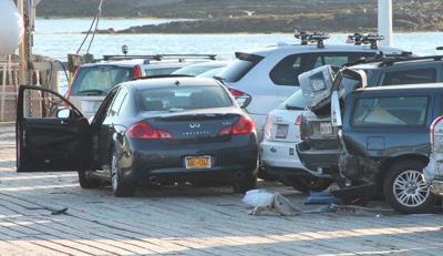 SUV crashes into three cars for sale on Cohasset lot
