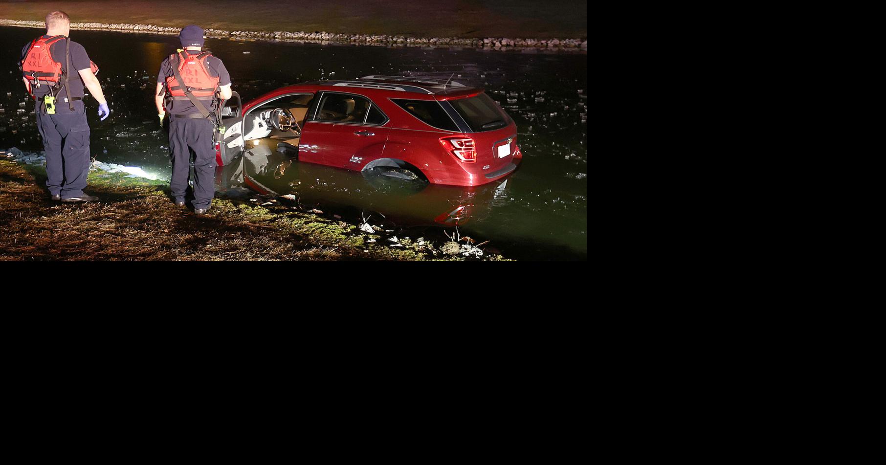 Woman helped to safety after car crashes into pond Police and Fire