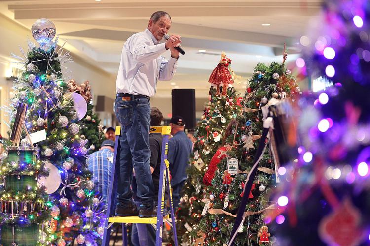 Holiday traditions return We Care TrimaTree auction brings in more than 84k News