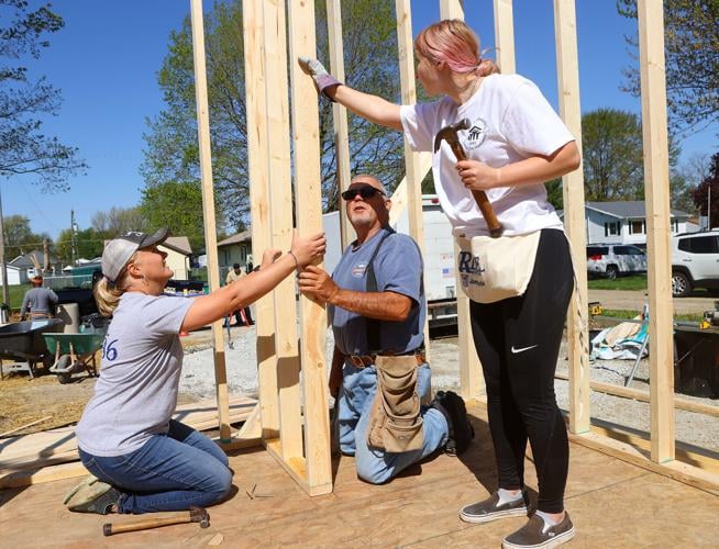 Volunteers help build new Habitat home for single mother News