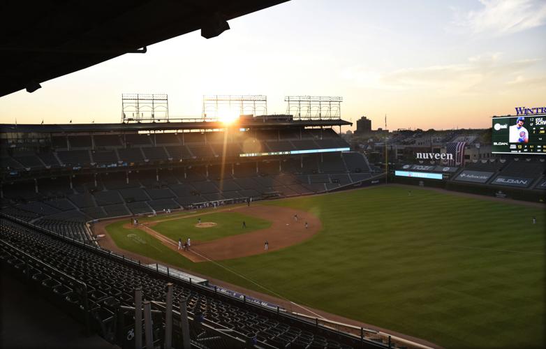 Empty stands, masked players as baseball returns