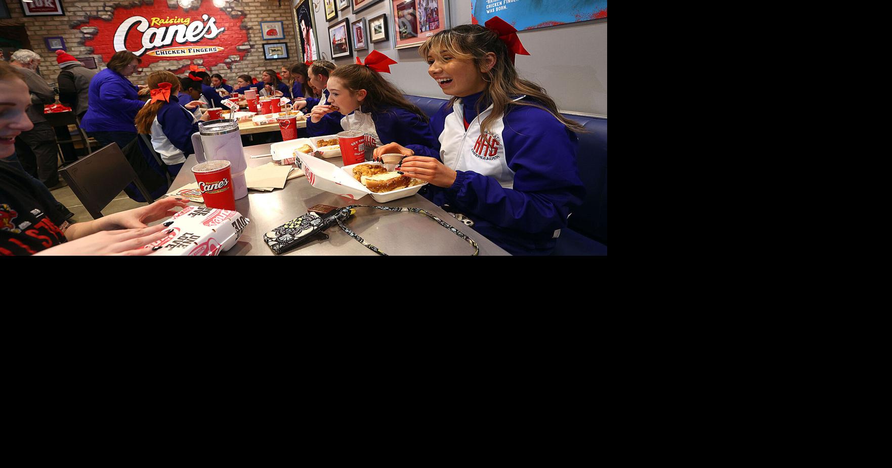 Raising Cane's holds grand opening Business