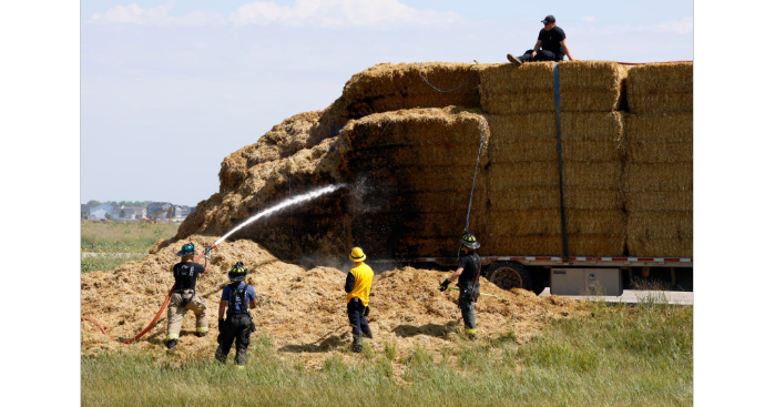 Hay bale trailer fire impacts traffic on I-29 just south of 52nd Avenue South in Fargo