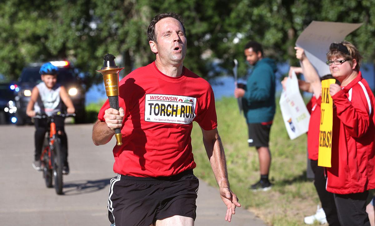 La Crosse Special Olympics athletes and law enforcement officers run in