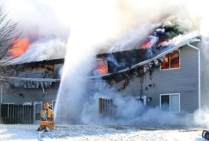 Fire and ice: Holmen apartment building destroyed as firefighters battle blaze in sub-zero temperatures