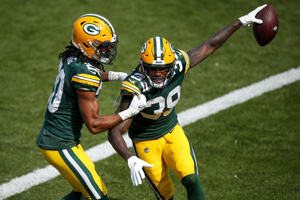 Jones Running Wild Lacrossetribune Com Aaron jones of the green bay packers waves at byron jones of the dallas cowboys as he rushes for a touchdown on october 6.