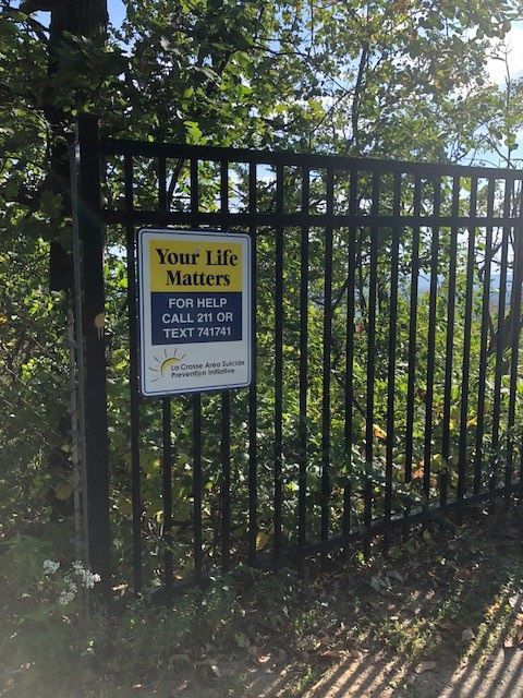 Your Life Matters signs on Grandad Bluff aim to instill hope vs