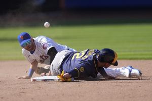 Brewers open the season with a win over the Mets as tempers flare