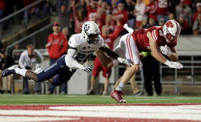 badgers football wisconsin flies past utah state after first half